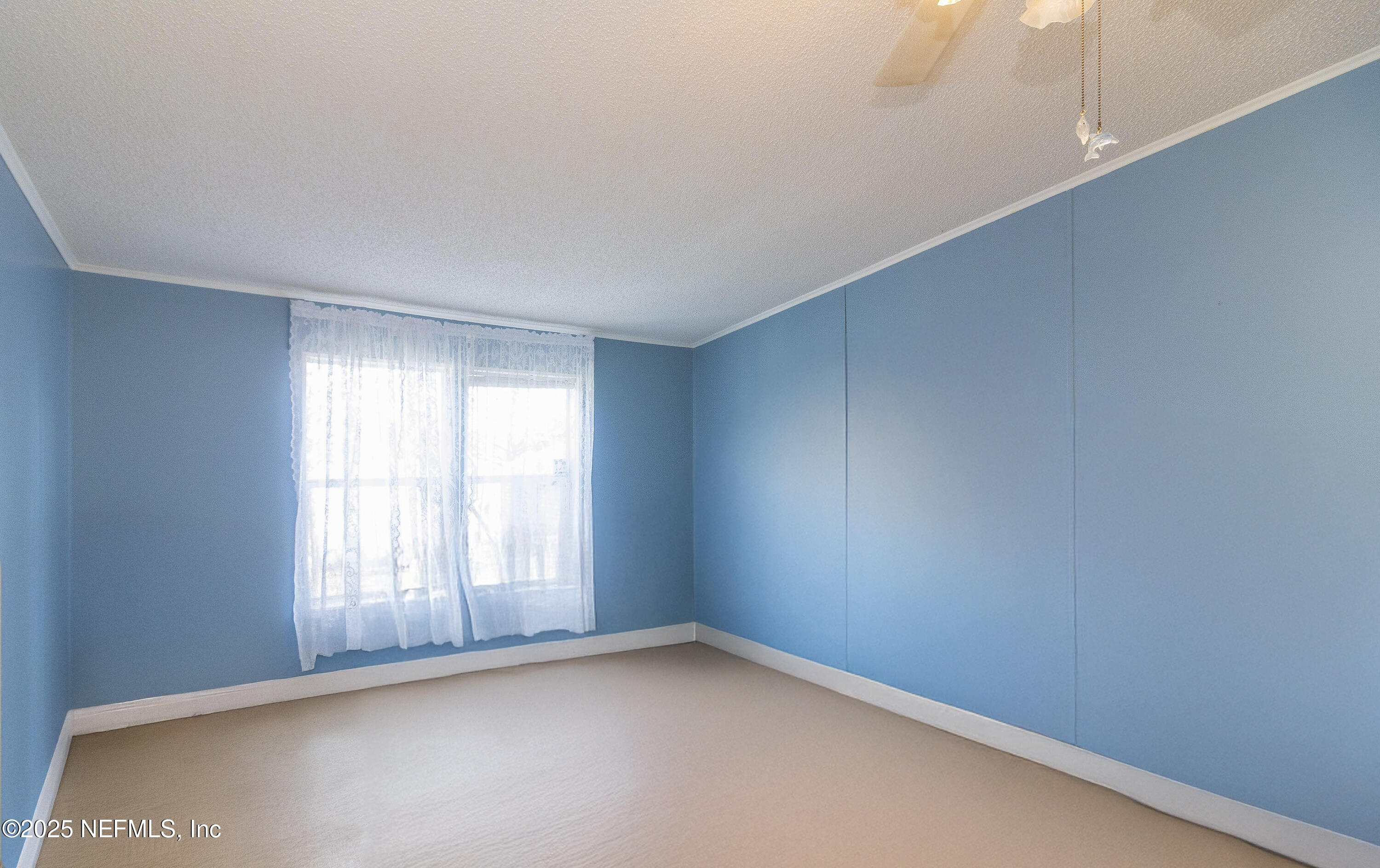 222 Kitty Avenue Interlachen, FL 32148 - Photo 33 of 34 an empty room with a window