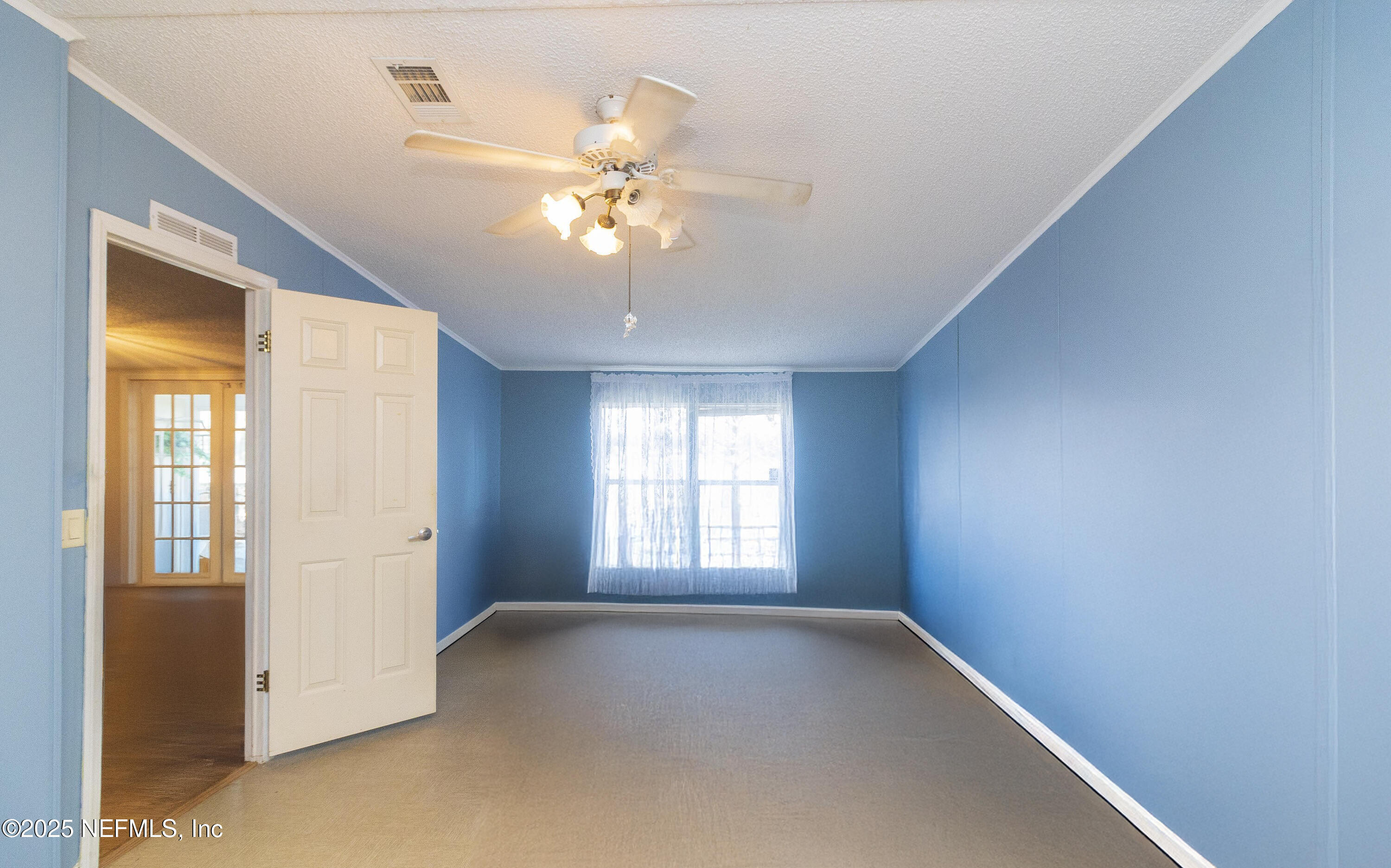222 Kitty Avenue Interlachen, FL 32148 - Photo 34 of 34 a view of an empty room with a window