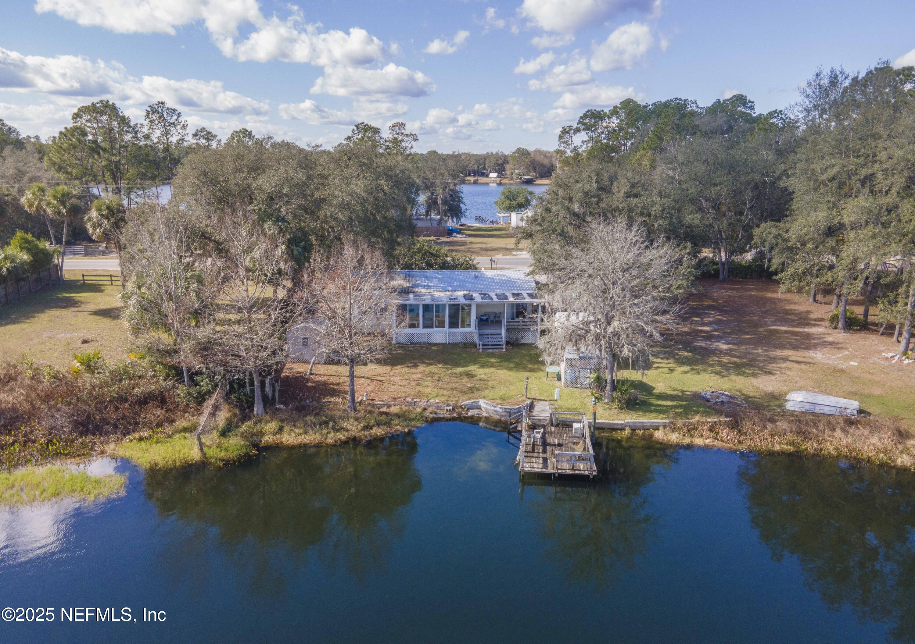 222 Kitty Avenue Interlachen, FL 32148 - Photo 6 of 34 a view of a lake with houses