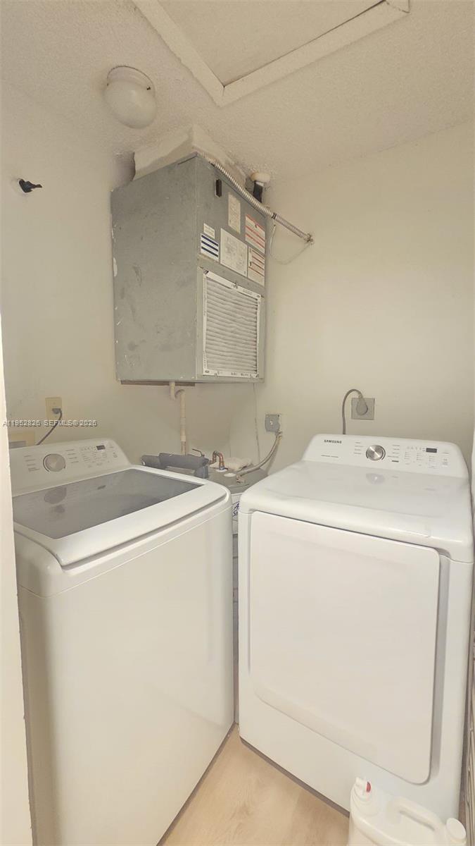 7911 Southwest 152nd Avenue, Unit 1008 Miami, FL 33193 - Photo 11 of 17 a utility room with dryer and washer