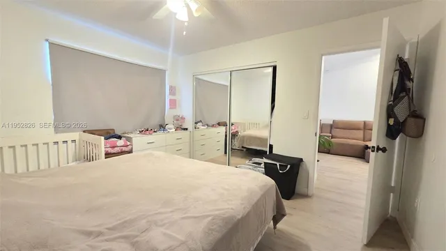 a bedroom with a bed and cabinets