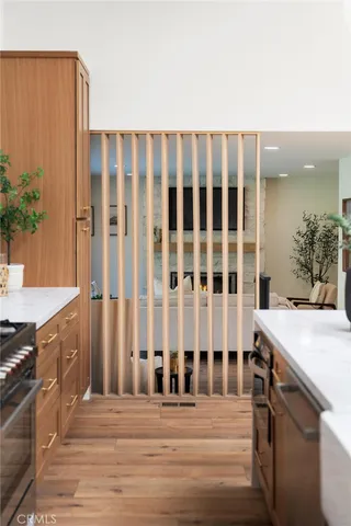 a kitchen with a stove and a white cabinets