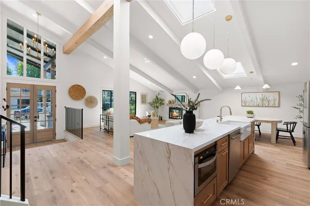 a kitchen with a stove a sink and a refrigerator