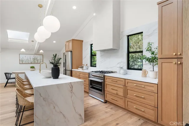 a room with a table chair and a potted plant