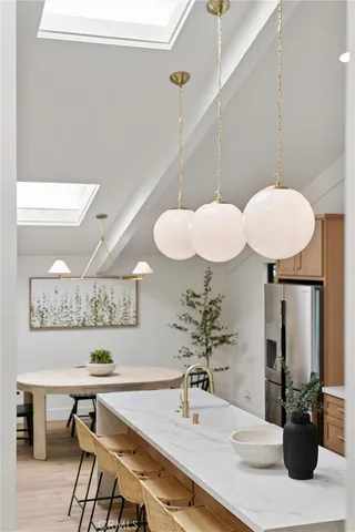 a kitchen with a table and chairs in it