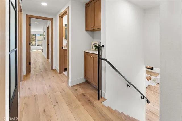 a view of hallway with wooden floor