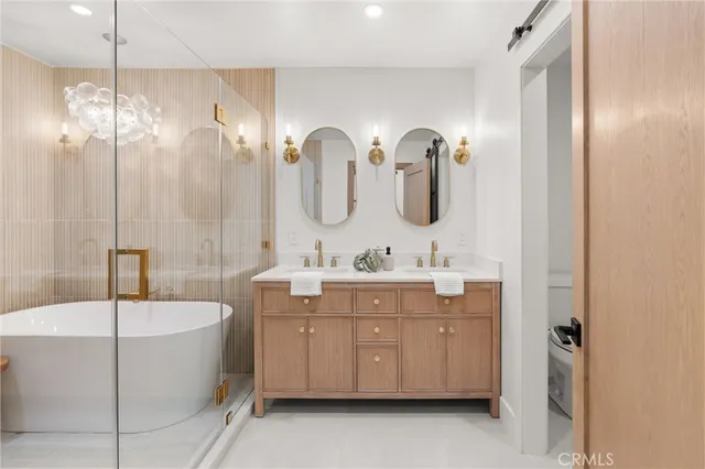 a bedroom with a large bed and a large window