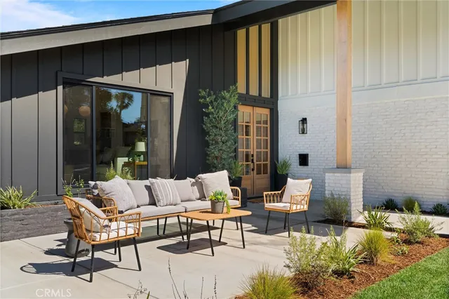a outdoor living space with furniture and a potted plant