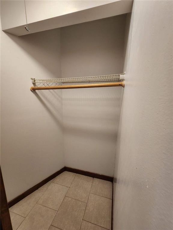 3186 Quince Tree Lane Decatur, GA 30034 - Photo 20 of 24 a view of storage and utility room with racks on the wall