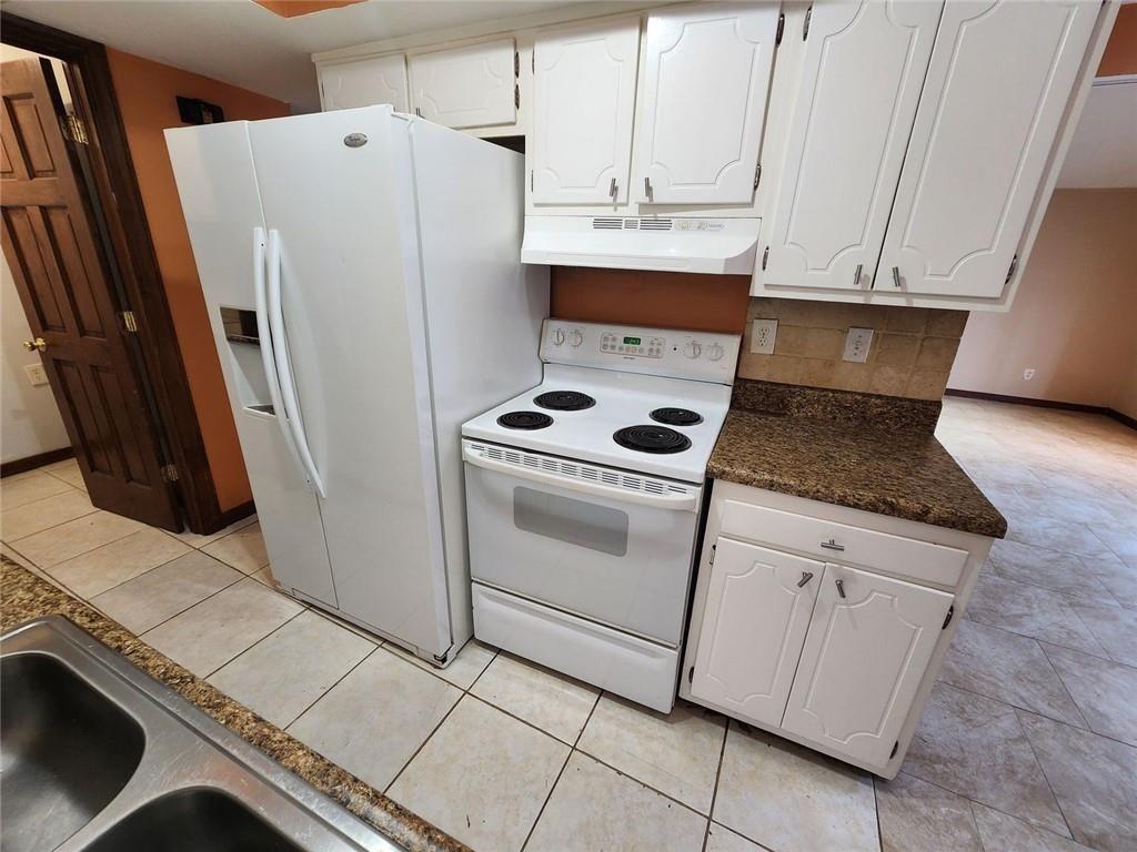 3186 Quince Tree Lane Decatur, GA 30034 - Photo 10 of 24 a kitchen with white cabinets and white appliances