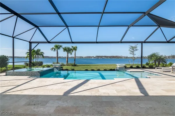 a view of a swimming pool with a yard