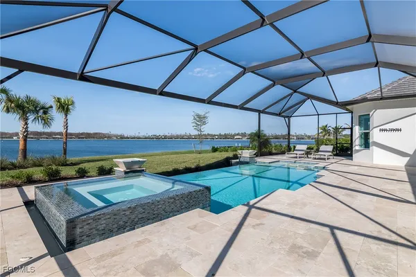 a view of a backyard with sitting area