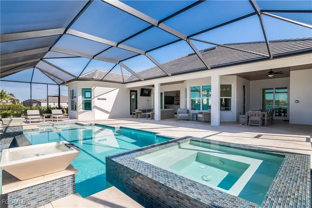 a view of a backyard patio with swimming pool table and chairs