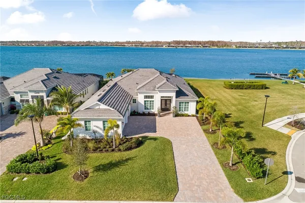 an aerial view of a house with outdoor space