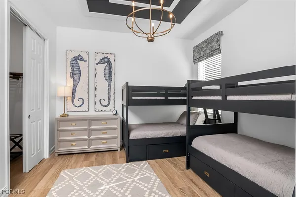 a bedroom with furniture and a window