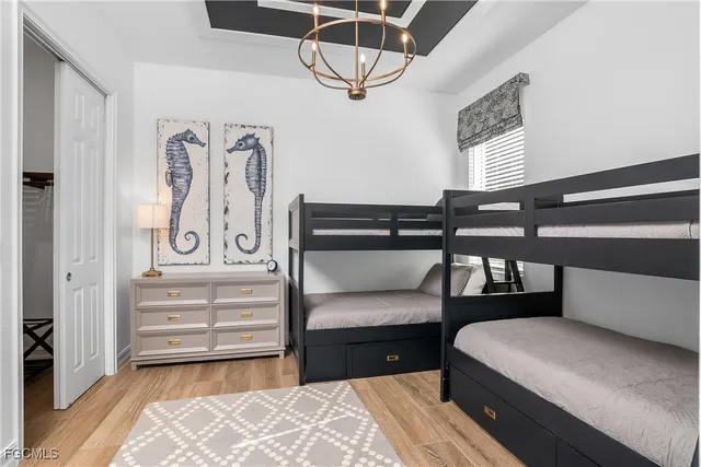 a bedroom with furniture and a window