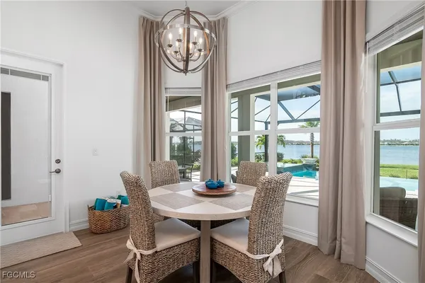 a view of a dining room with furniture window and outside view