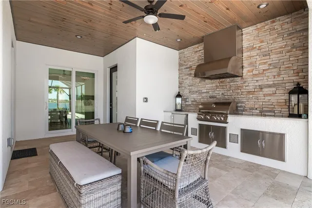a open kitchen with a table and chairs in it