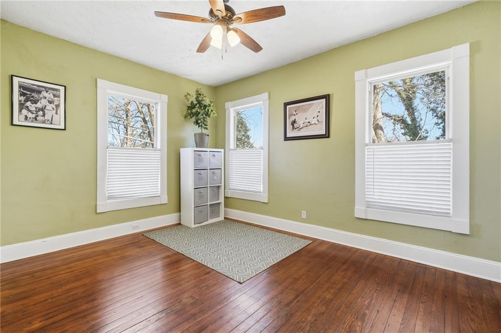 1420 Sylvan Road Southwest Atlanta, GA 30310 - Photo 11 of 43 a view of an empty room with wooden floor and a window