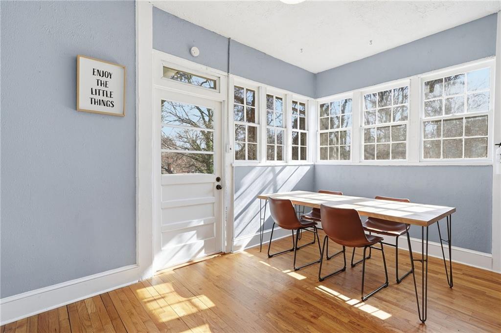 1420 Sylvan Road Southwest Atlanta, GA 30310 - Photo 17 of 51 a workspace with furniture window and wooden floor