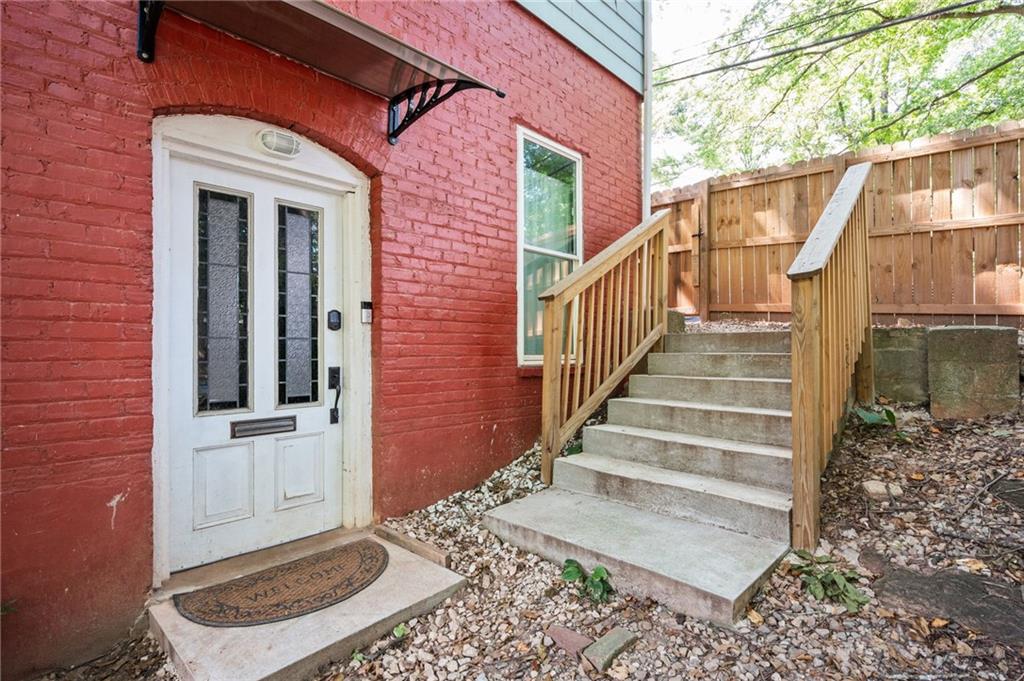 1420 Sylvan Road Southwest Atlanta, GA 30310 - Photo 2 of 43 a view of a brick house with wooden floor and a large window