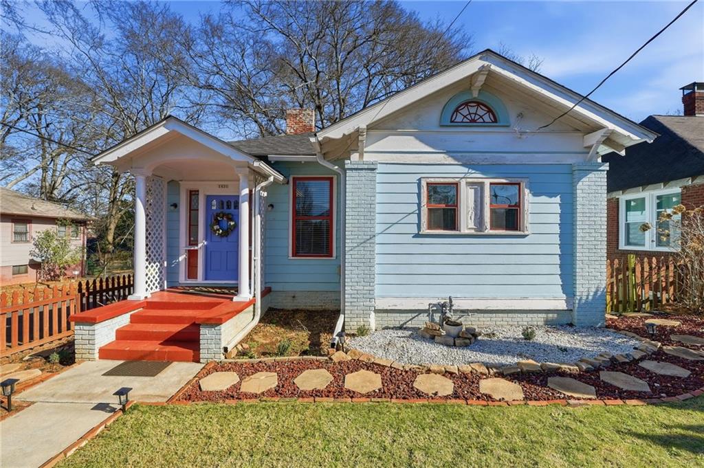 1420 Sylvan Road Southwest Atlanta, GA 30310 - Photo 2 of 51 a front view of a house with garden