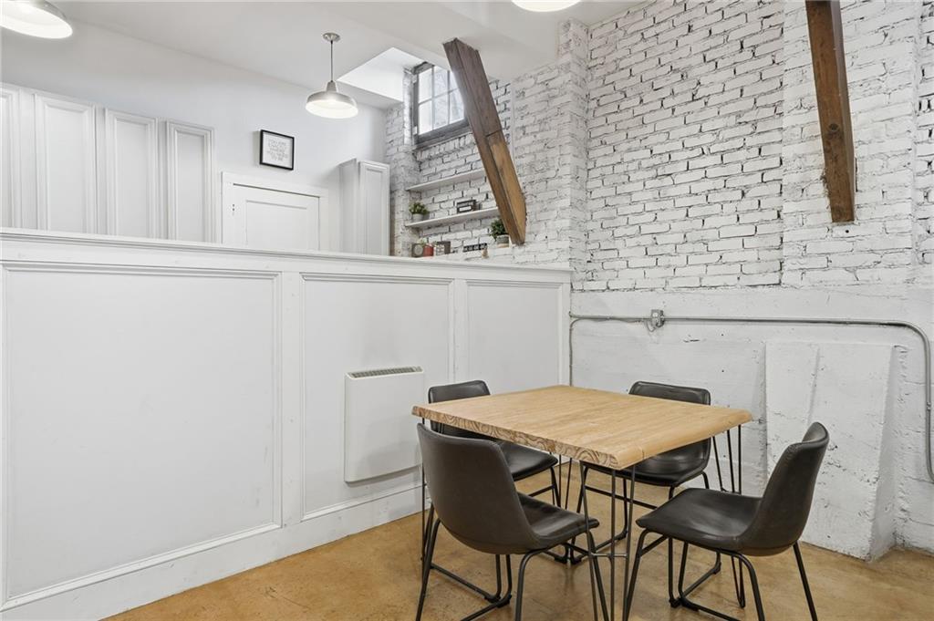 1420 Sylvan Road Southwest Atlanta, GA 30310 - Photo 22 of 43 a view of a dining room with furniture and wooden floor