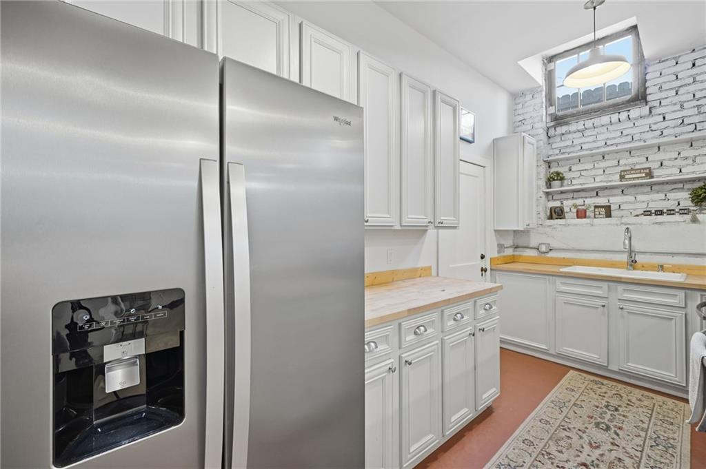 1420 Sylvan Road Southwest Atlanta, GA 30310 - Photo 26 of 43 a large kitchen with a refrigerator and a sink