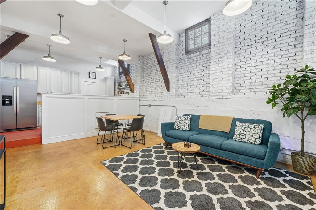 1420 Sylvan Road Southwest Atlanta, GA 30310 - Photo 28 of 51 a living room with furniture and a rug