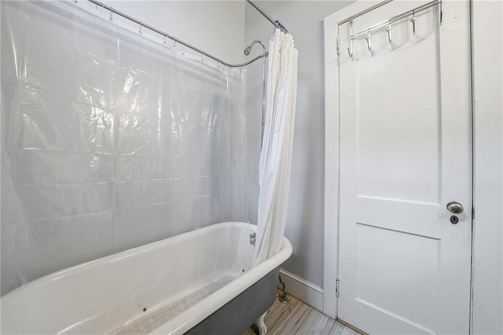 1420 Sylvan Road Southwest Atlanta, GA 30310 - Photo 31 of 43 a bathroom with a bathtub and a shower