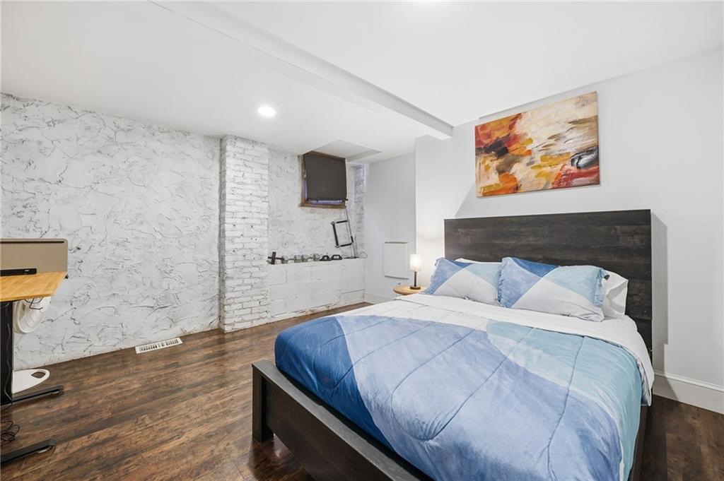 1420 Sylvan Road Southwest Atlanta, GA 30310 - Photo 39 of 51 a bedroom with a bed and a painting on the wall