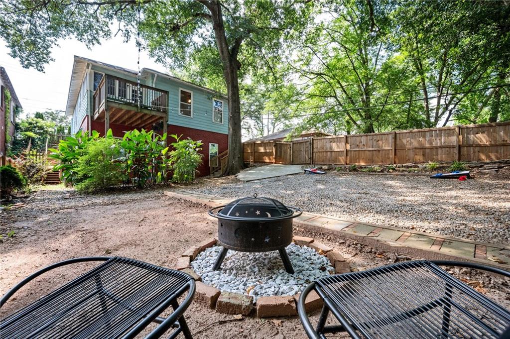 1420 Sylvan Road Southwest Atlanta, GA 30310 - Photo 42 of 51 a backyard of a house with potted plants and large tree