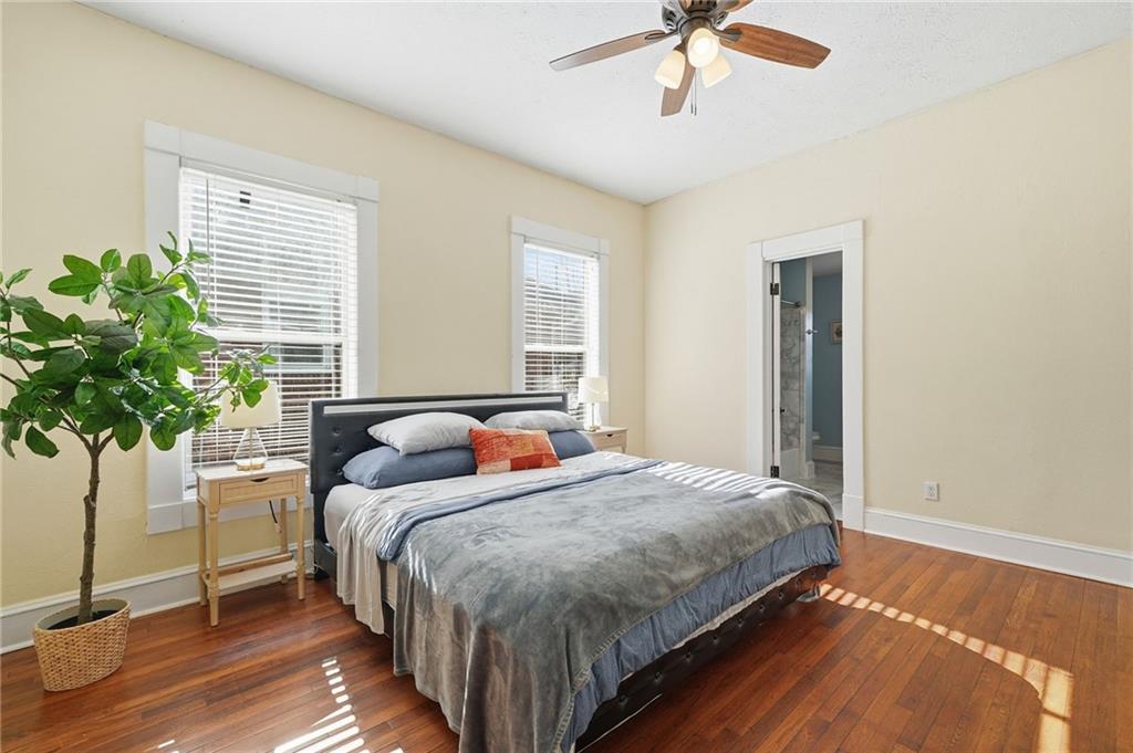 1420 Sylvan Road Southwest Atlanta, GA 30310 - Photo 7 of 43 a bedroom with bed and a potted plant