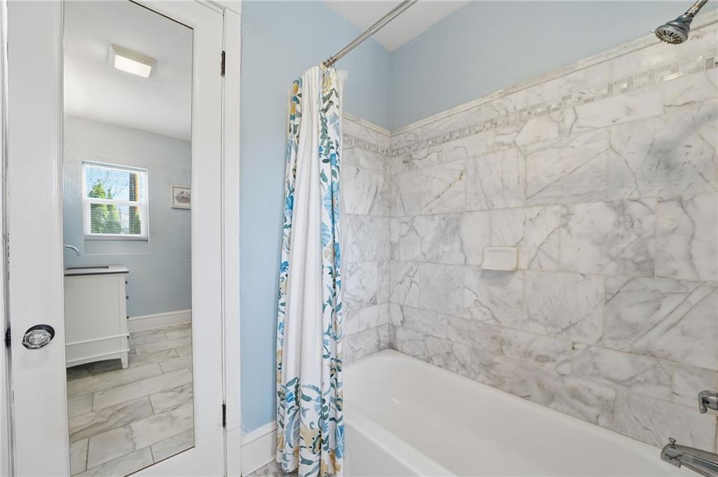 1420 Sylvan Road Southwest Atlanta, GA 30310 - Photo 8 of 43 a bathroom with a bathtub and shower