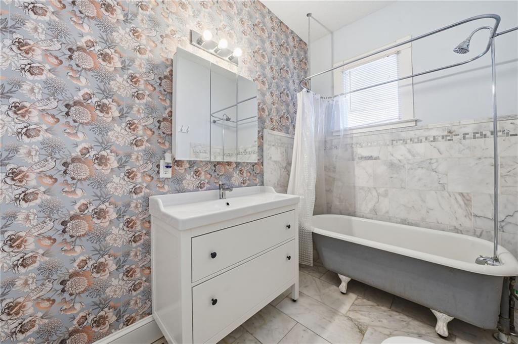 1420 Sylvan Road Southwest Atlanta, GA 30310 - Photo 10 of 43 a bathroom with a sink and a mirror