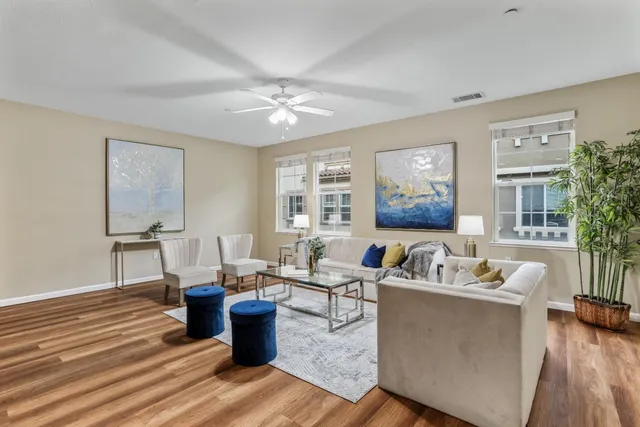 a living room with furniture or couch and a wooden floor