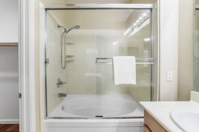 a bathroom with a bathtub and a shower