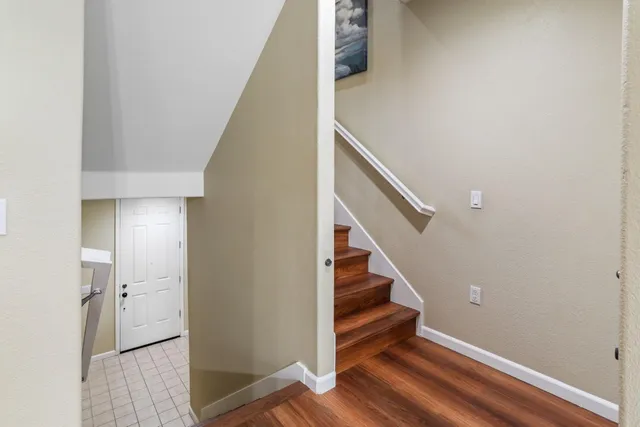 a view of entryway with stairs and wooden floor