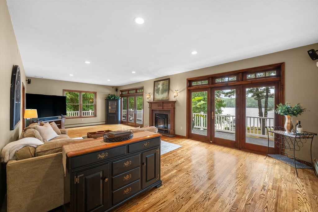 14 Demond Pond Row Rutland, MA 01543 - Photo 9 of 42 a bedroom with furniture and large windows