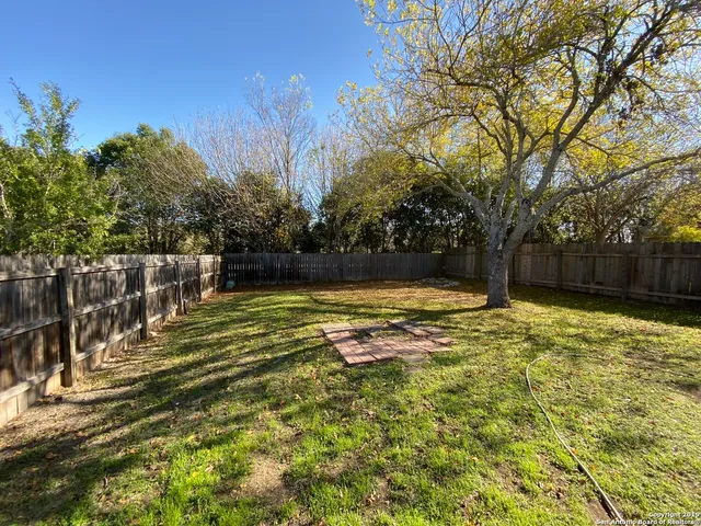 a view of a swimming pool with an outdoor space and seating area