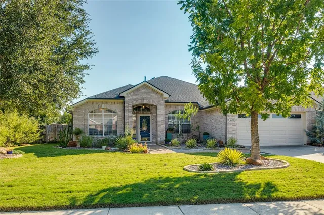 a front view of house with yard outdoor seating and yard