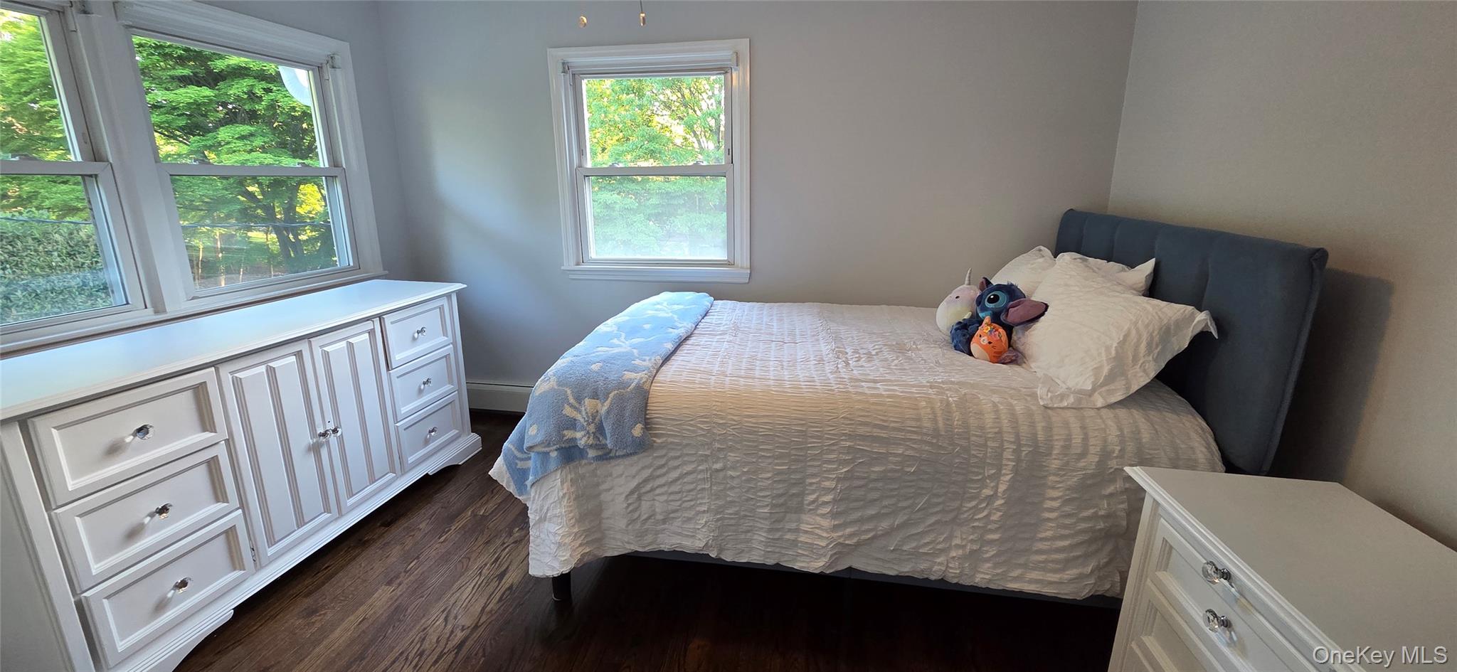522 Moriches Road St. James, NY 11780 - Photo 28 of 49 a bedroom with a bed and a window