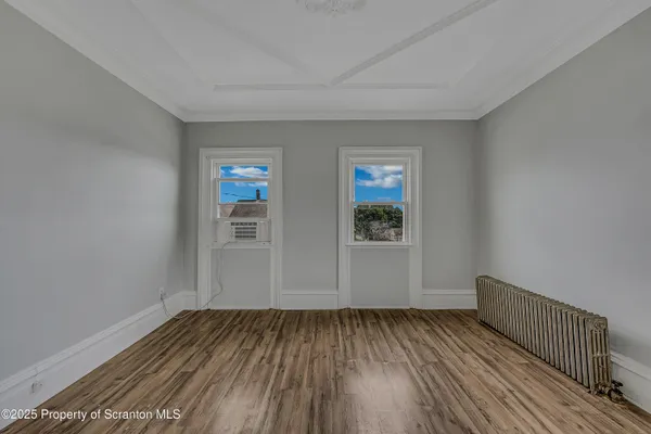 a view of a room with wooden floor and interior