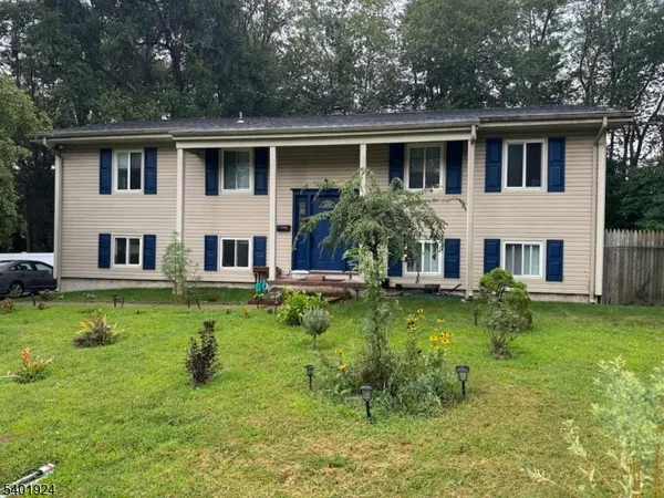 a house view with a garden space