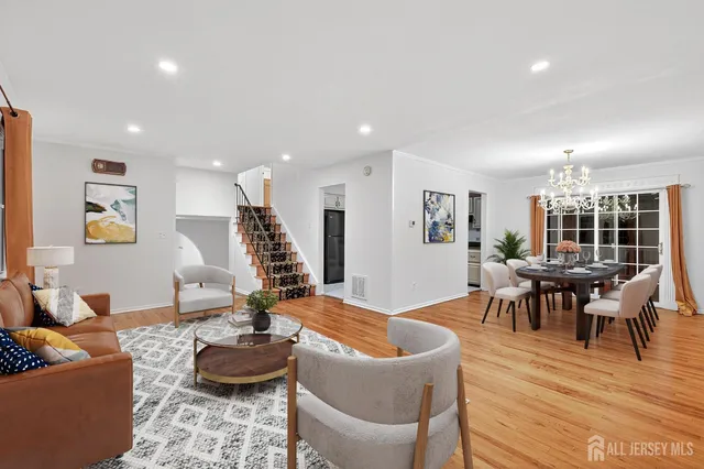 a large room with wooden floor and windows
