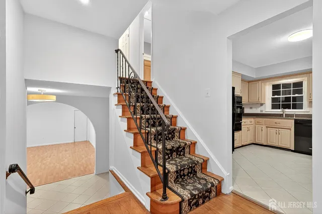 a view of hallway with wooden floor