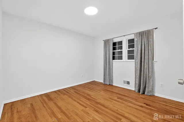 a bathroom with a sink toilet a mirror and shower