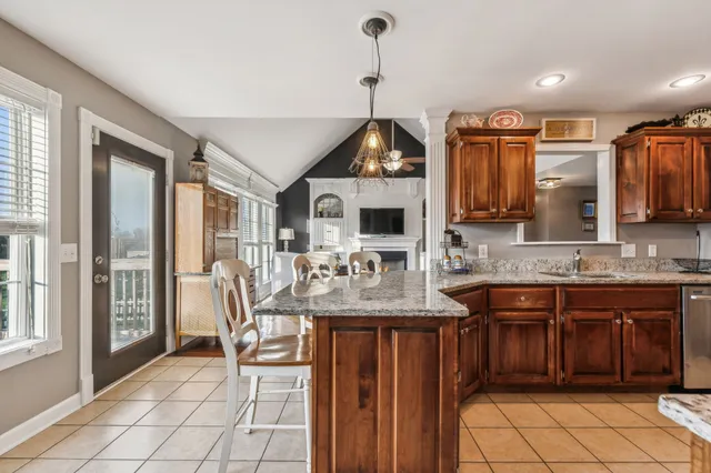 a kitchen with stainless steel appliances granite countertop a stove and a sink