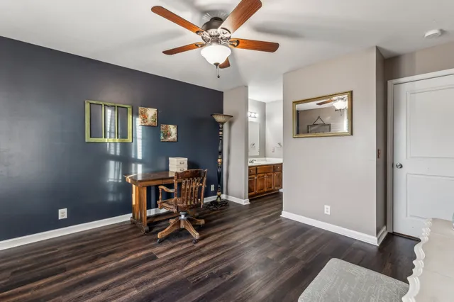 a work room with furniture and a window