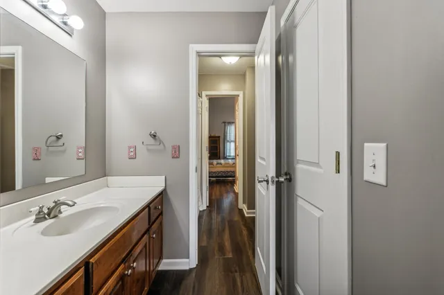 a en suite bathroom with a sink and a mirror